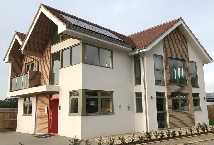 Build It House with mixed blend of red country brown and brown heather sanded tiles